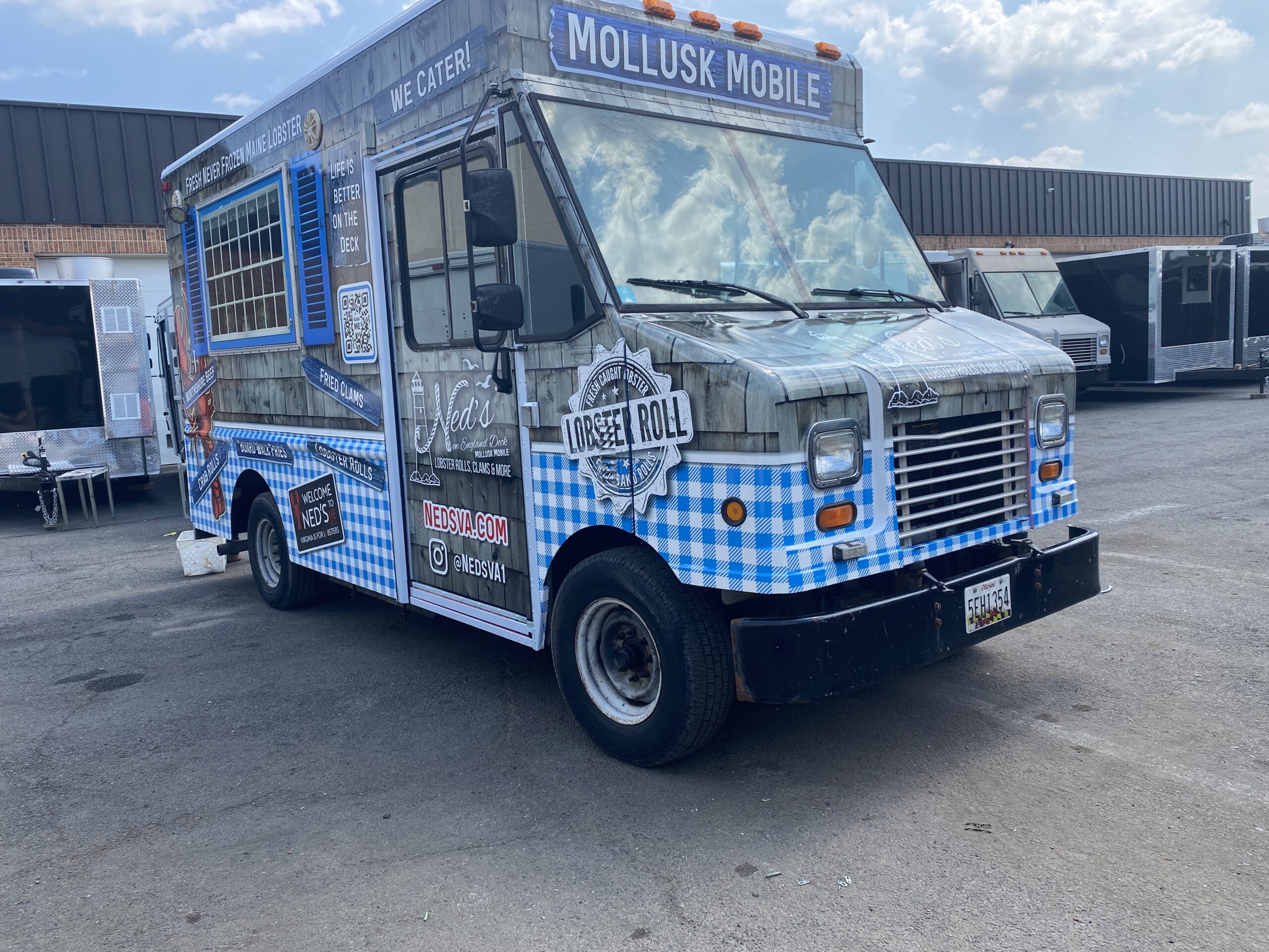 Ned's New England Deck Mollusk Mobile food truck, 3-quarter front view